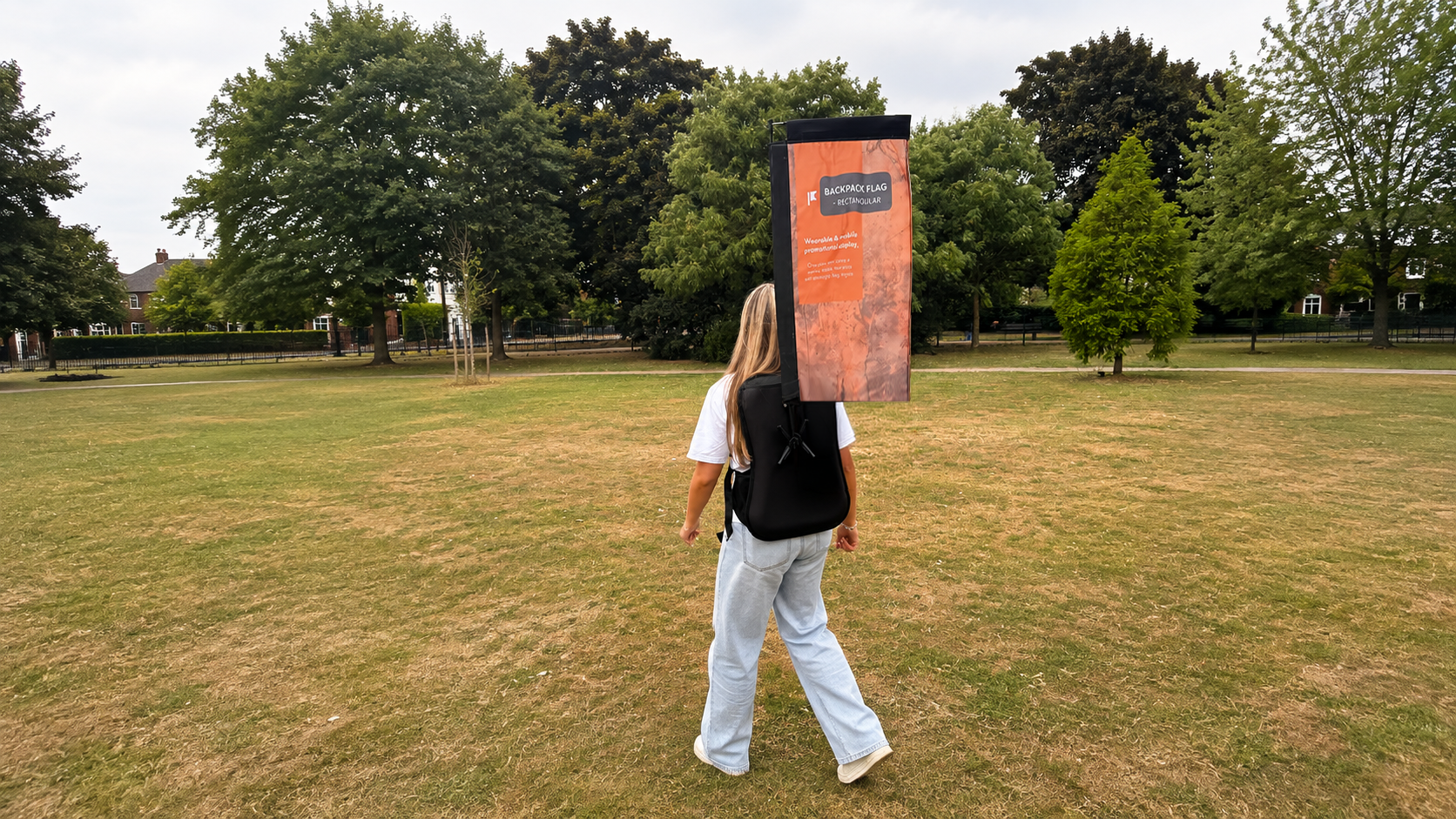 Rectangular backpack flag being worn outdoors as a mobile advertising display