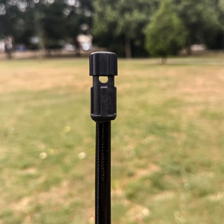 Close-up of locating hole near the top of the rectangular backpack flag vertical support pole
