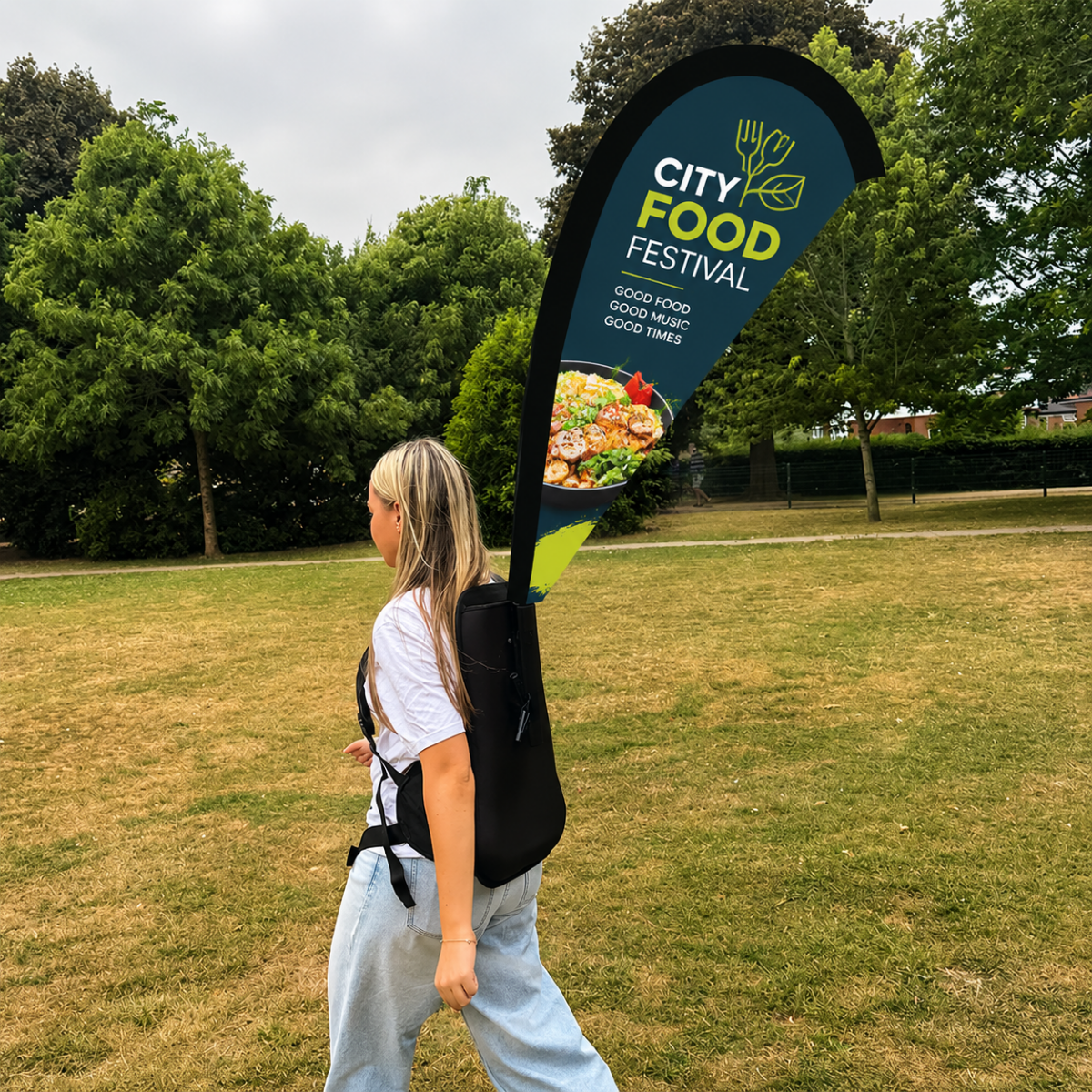 Teardrop backpack advertising flag being worn outdoors