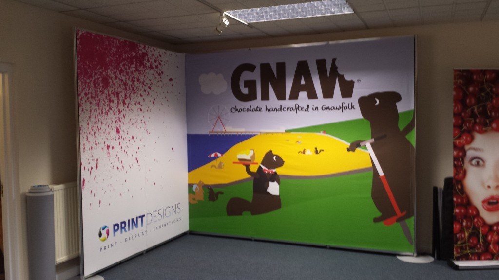 shell clad graphic produced in one piece with fabric