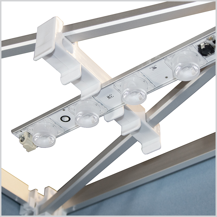 An image showing how the options LED lights attach to the top of the SEG Fabric Pop Up Stand frame