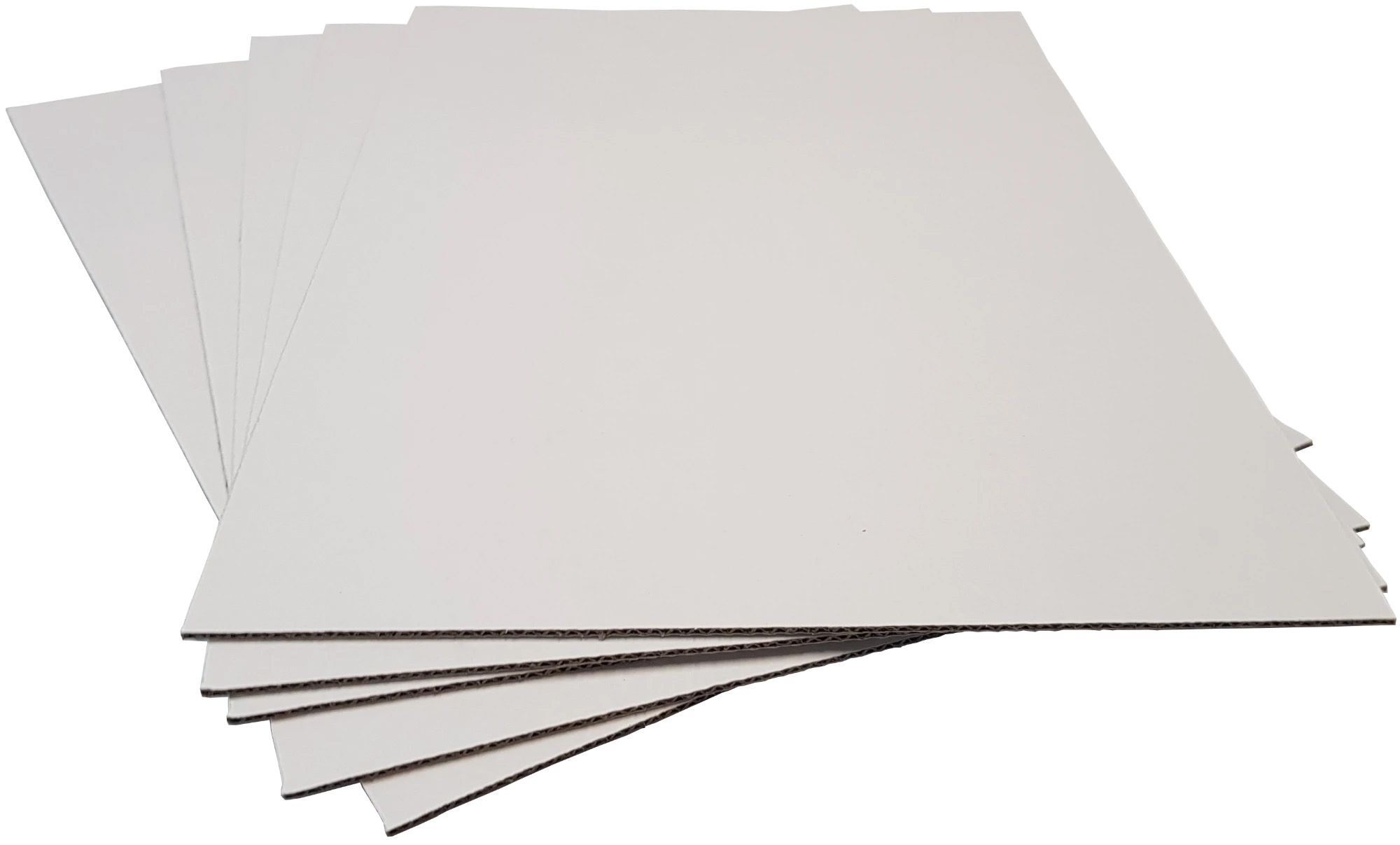 Sheets of white-lined corrugated cardboard used to manufacture the Cardboard Monolith Display